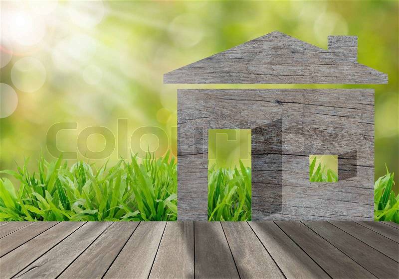 Wooden house on green grass field in morning sunlight,environment concept, stock photo