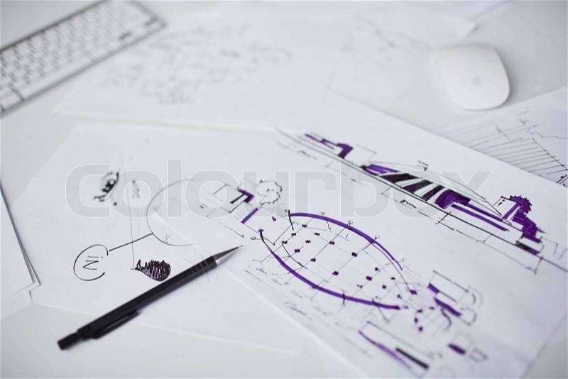 Image of sketches and pen at workplace, stock photo