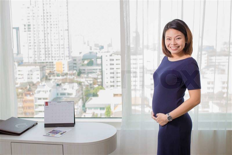 Beautiful Asian woman with a pretty smile. \'re Happy with pregnancy, stock photo
