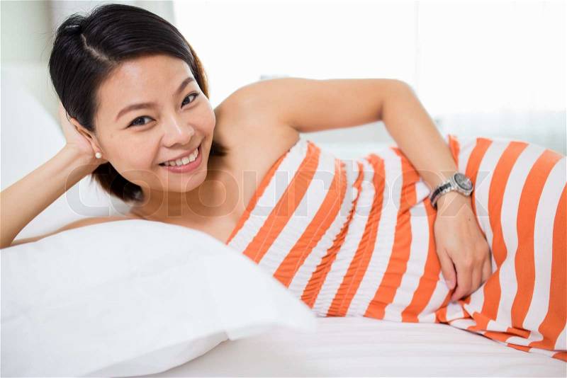 Beautiful Asian woman with a pretty smile. \'re Happy with pregnancy, stock photo