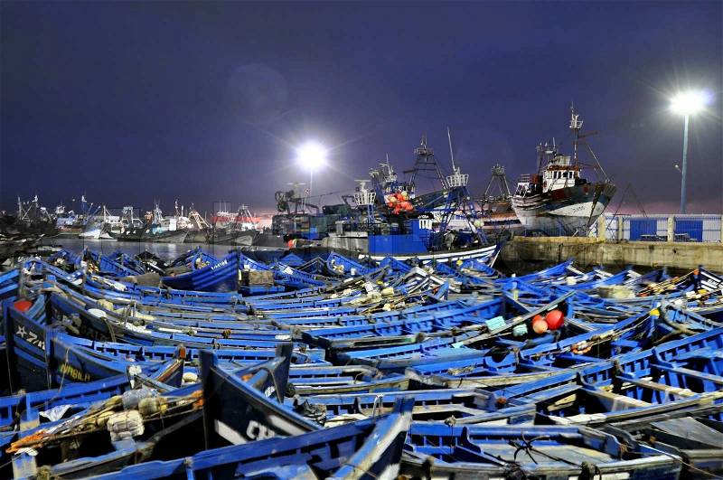 Blue fishing boats of Essaouira at night, stock photo