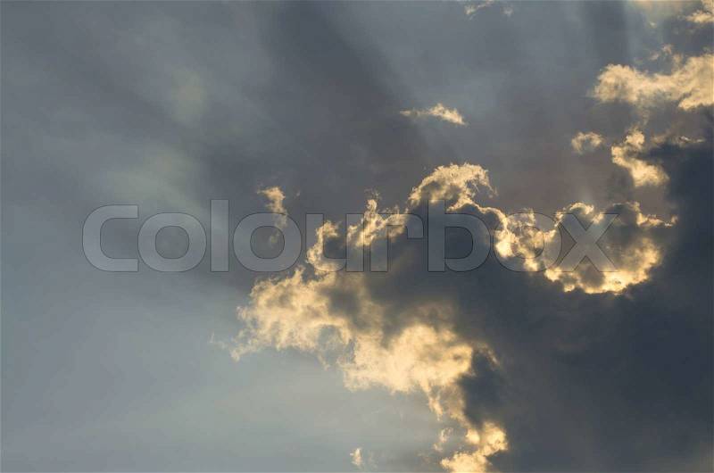 Clouds on the sky with sun ray, background, stock photo