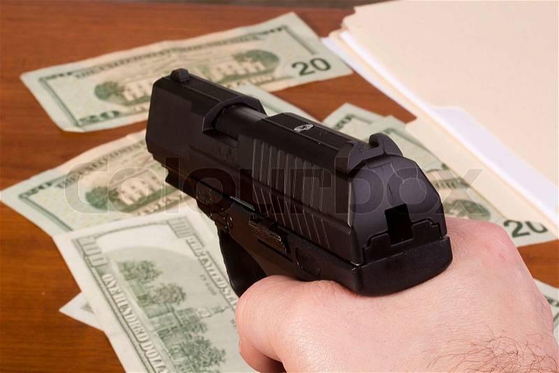 Robbery with the use of a gun, stock photo