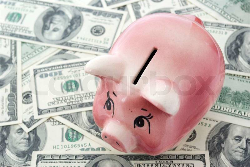 Piggy bank on a dollars, stock photo