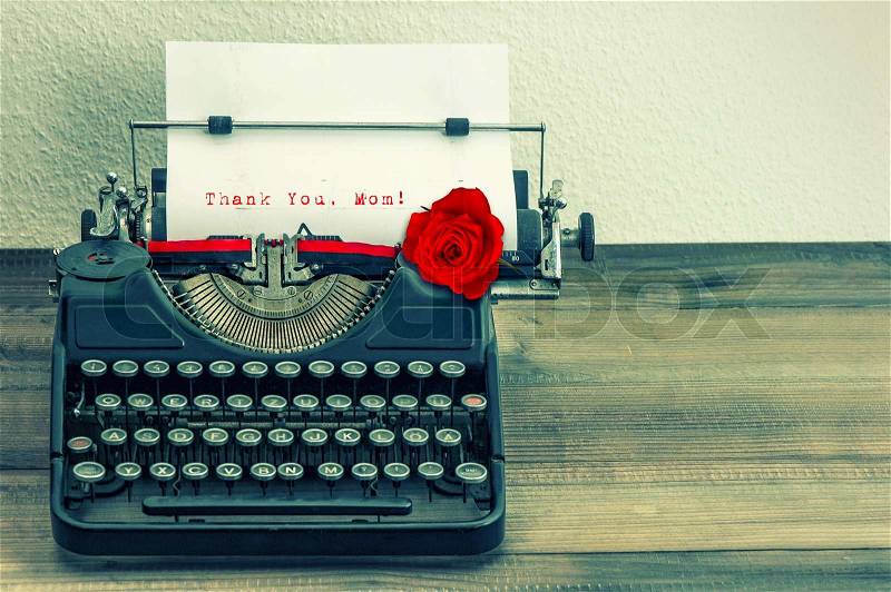Vintage typewriter with white page and red rose flower. sample text Thank You, Mom! Mother\'s Day concept, stock photo