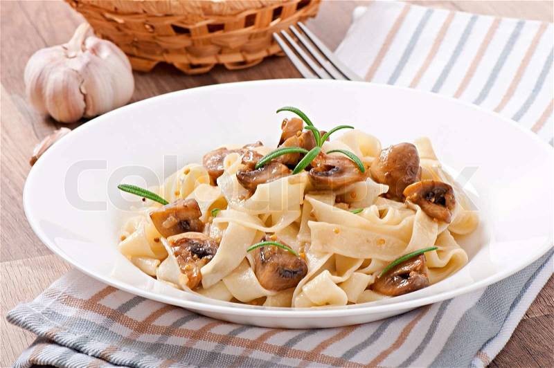 Vegetarian dish with tagliatelle and mushrooms, stock photo