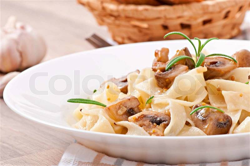 Vegetarian dish with tagliatelle and mushrooms, stock photo