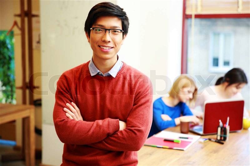 Happy young asian student in classroom, stock photo