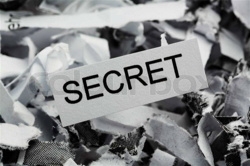 Shredded paper tagged with secret, symbol photo for data destruction, banking secrecy and economic espionage, stock photo