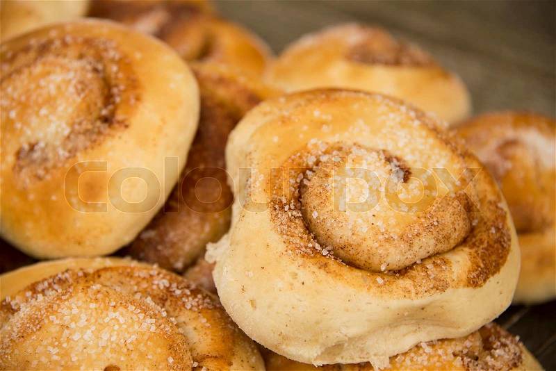 Close-up of cinnamon buns on a tray, stock photo
