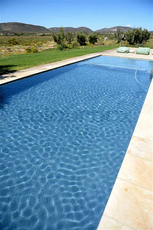 A safari lodge swimming pool in Africa, stock photo